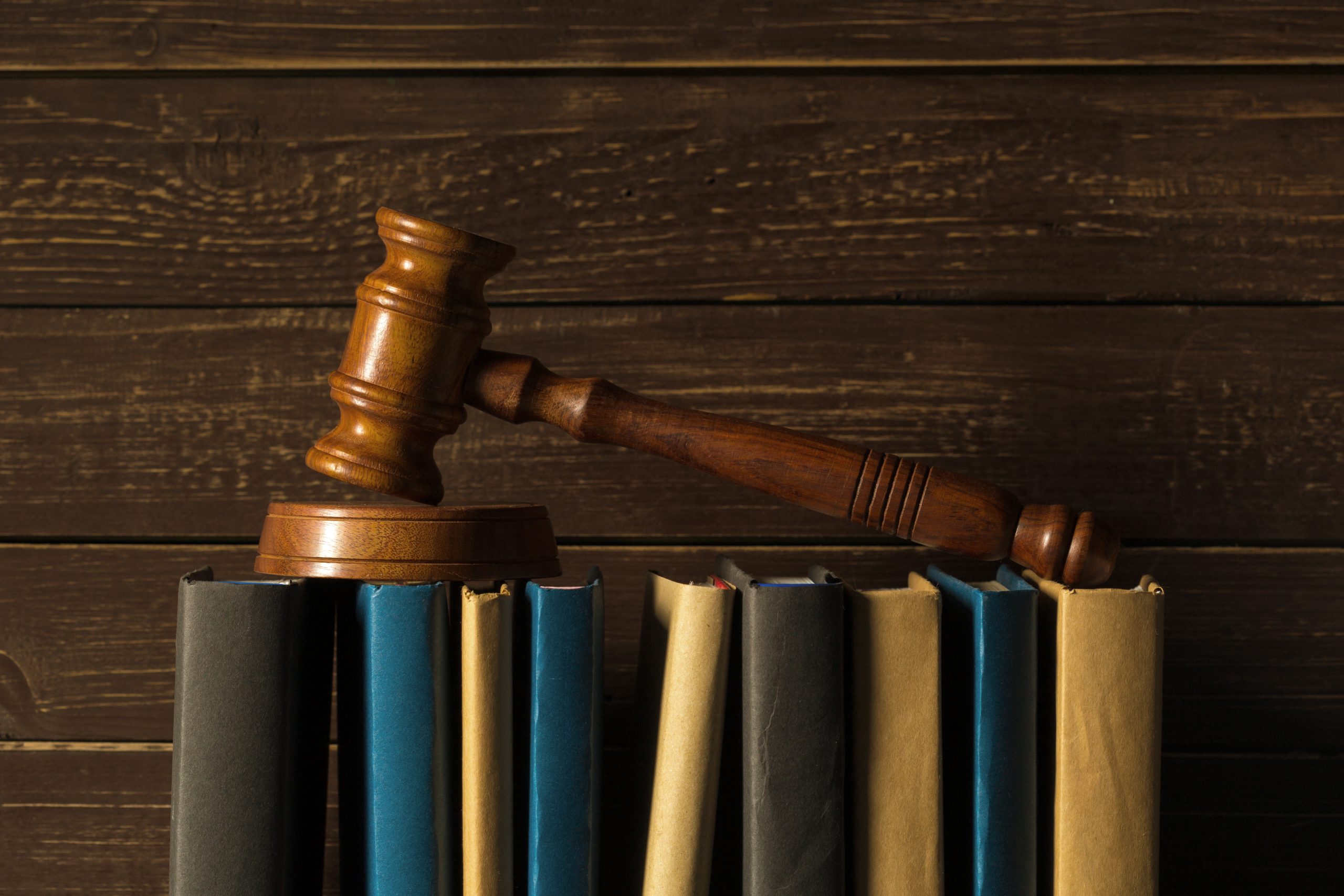 gavel with books old wooden desk scaled